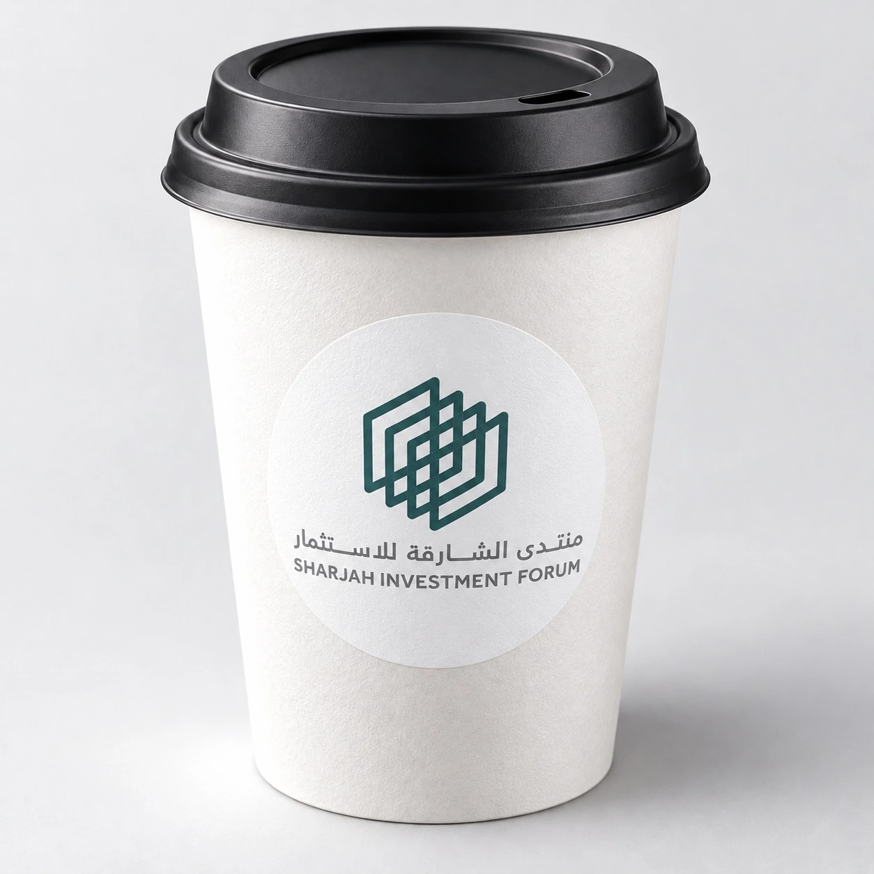 Illustrative cup mockup with a Sharjah Investment Forum round sticker
